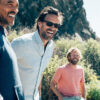 Three men in the countryside wearing sustainable & ethical clothing