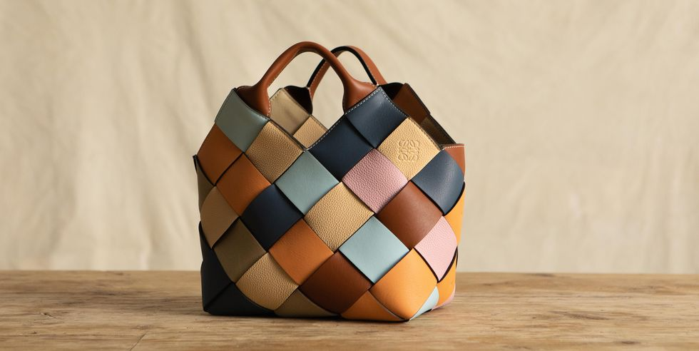 A sustainable handbag with a multicoloured diagonal hatch design